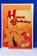 Handmade kawaii autumn leaf birthday shaker card with red Happy Birthday greeting and circular leaf window.
