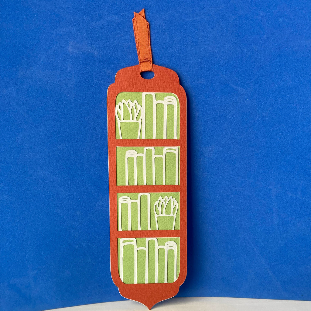Bookmark with books - On a bookshelf
