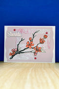Handmade STERKTE sympathy card with plum blossom branch and pink marble-patterned panels